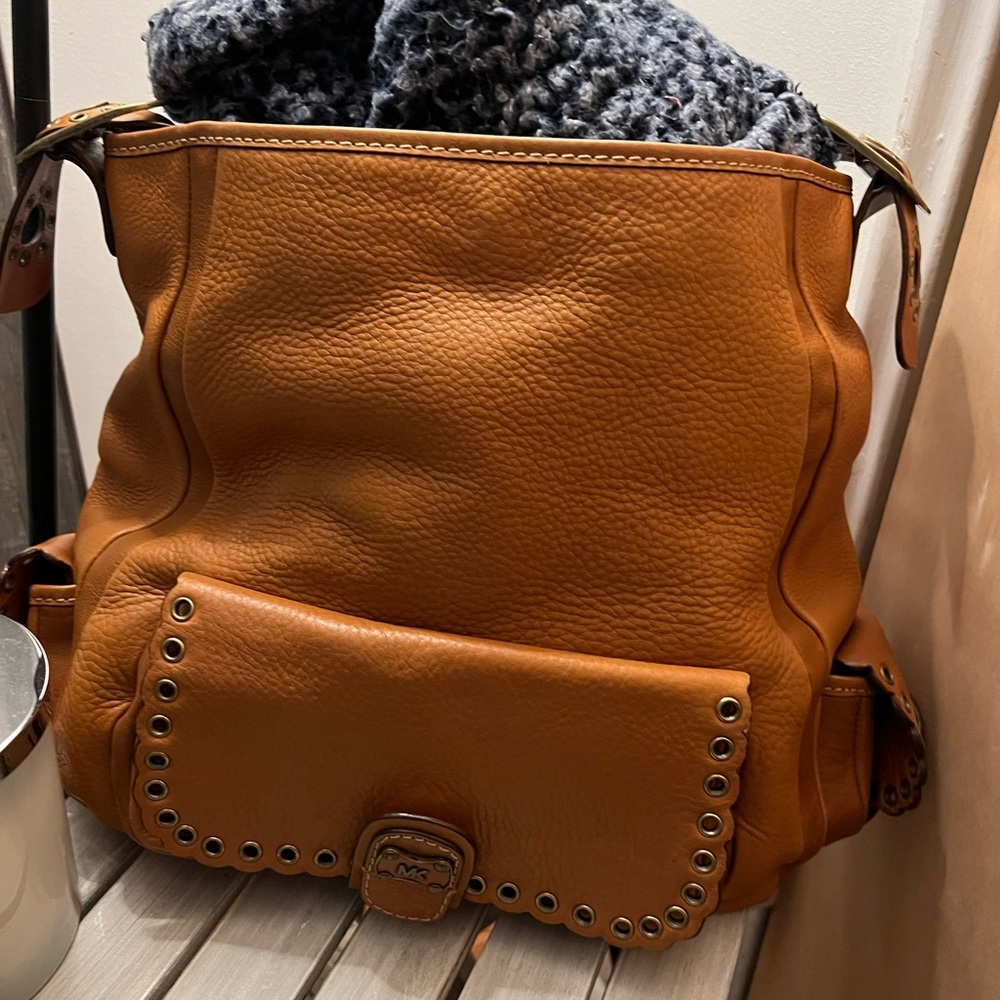 Brand new Michael Kors leather vintage bag one of his first bags only use once.